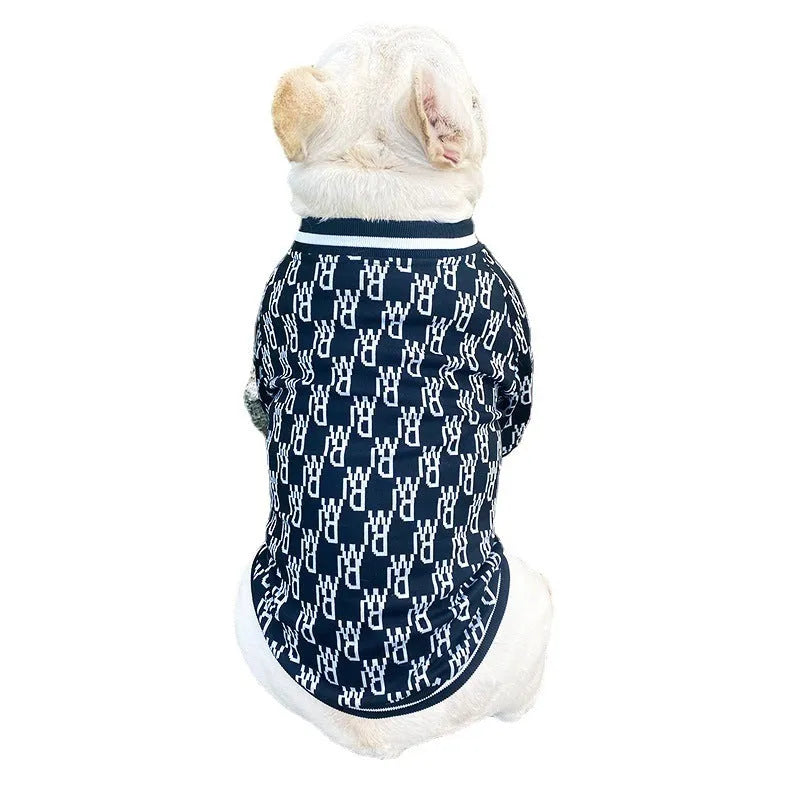 Black zip up dog jacket made of stretchy polyester on a small dog, size S, with a side view showing the zip and fabric fit.