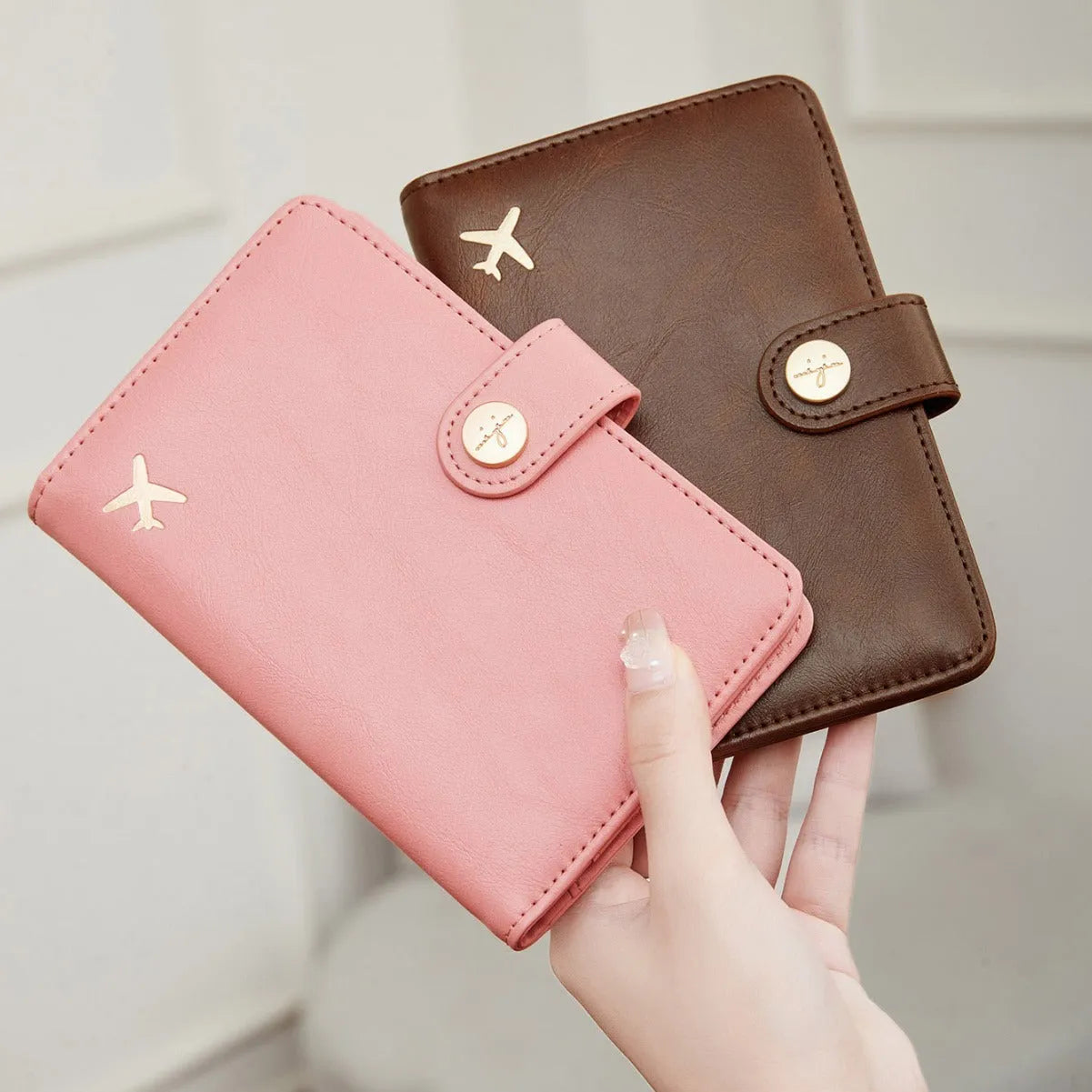 Women's PU passport holder with aircraft pattern design in multiple colour options showing organised document storage compartments