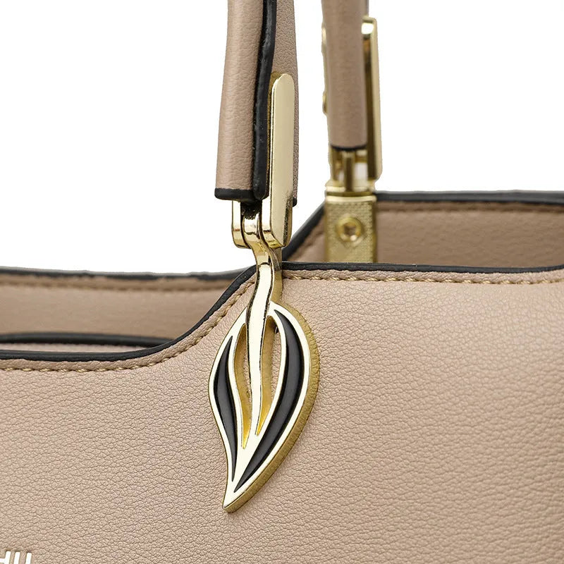 Women's black PU leather messenger bag with multi-layer shoulder strap and sewing thread detailing