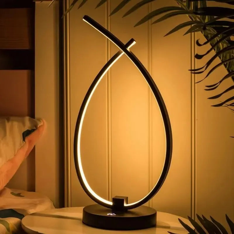 Black and white water drop shaped USB bedside table lamp measuring 30cm tall