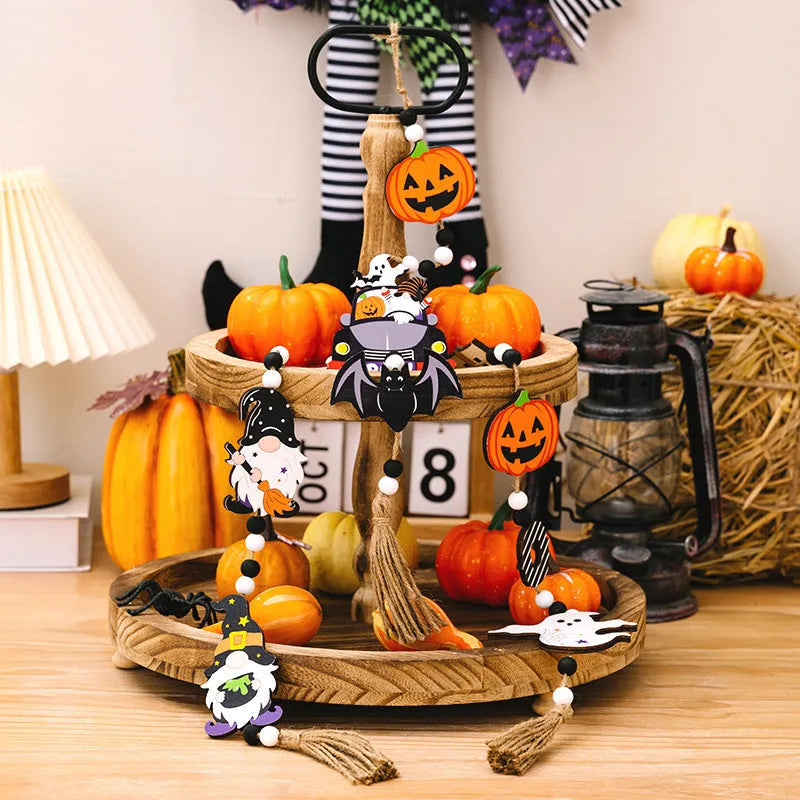 Resin Halloween pendant string with BOO ghost design hanging on a wall