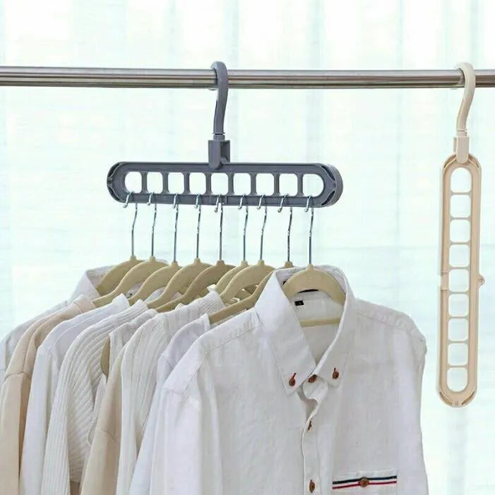 Pink plastic clothes hanger with a 360-degree rotating hook on a white background.