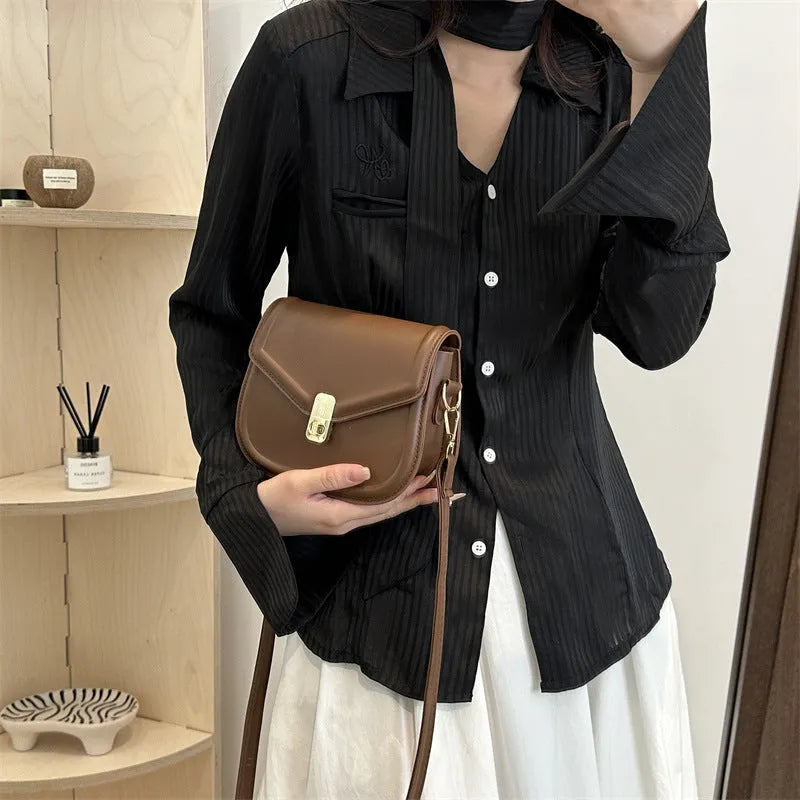 Soft PU leather shoulder messenger bag with clamshell opening in khaki colour, shown from the front.