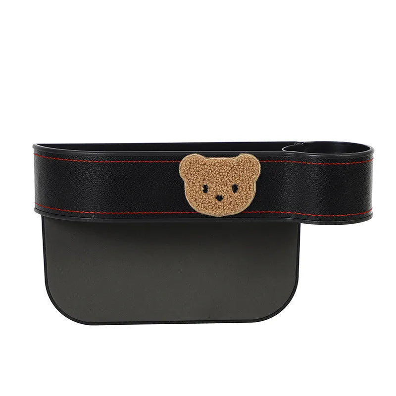 Leather car seat gap storage box with cartoon bear design for centre console organisation.