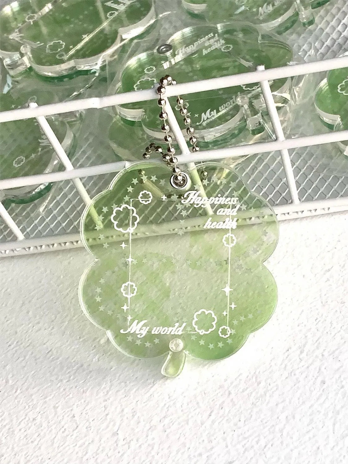 Acrylic four-leaf clover mobile phone pendant charm in blue, green, or mint colour options