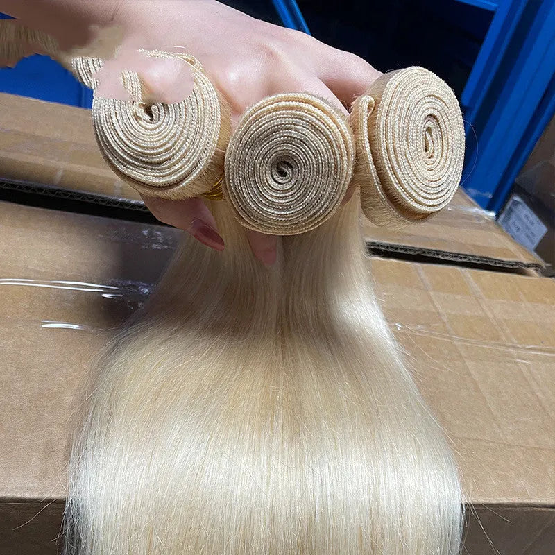 Gold human hair curtain bone straight wig on mannequin head showing long hair length
