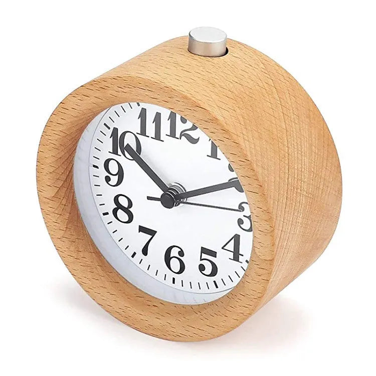 Solid beech wood analogue alarm clock with silent snooze on a wooden bedside table.
