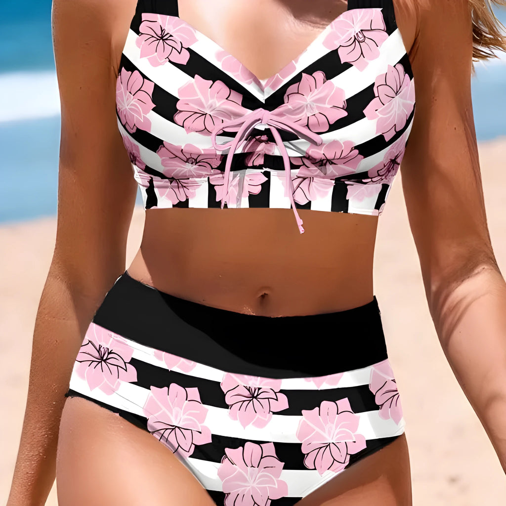 Black women's bikini with covered belly and split style for swimming.