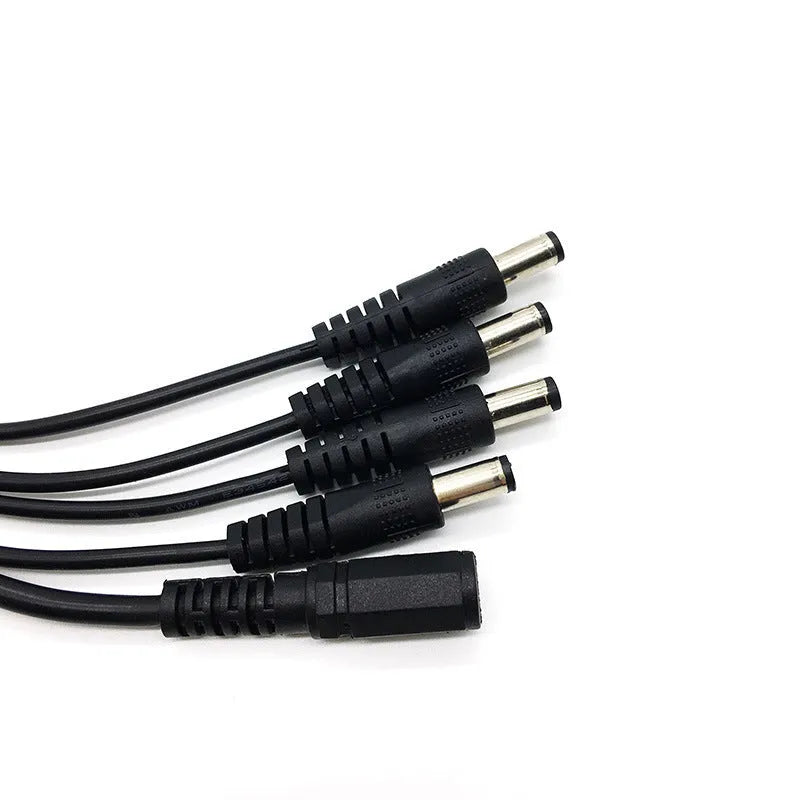 Black DC monitoring power cord with one input and four output connectors for security cameras