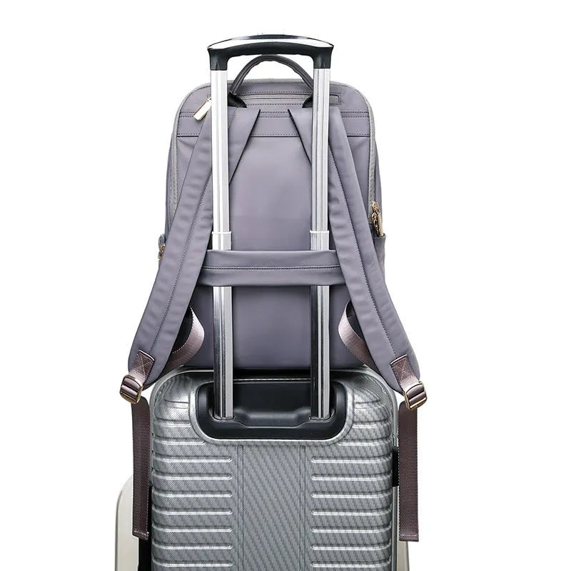 Oxford cloth women's large capacity backpack in black shown with anti-theft zip and breathable back panel.