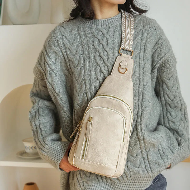 Soft PU women's crossbody bag in street-trend style with open pocket and sewing thread detail.