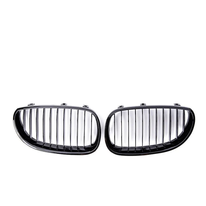 Pair of ABS carbon fibre pattern grilles for a BMW 5-Series front bumper.