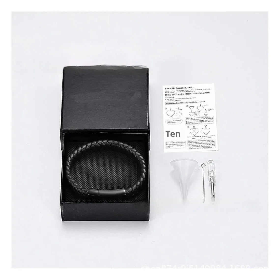 Black stainless steel and leather memorial bracelet with personalised lettering in a gift box.
