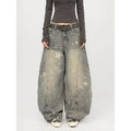 Men's blue loose fit jeans with vintage washed, distressed and grey splatter finish, mid-rise waist and long pant length.
