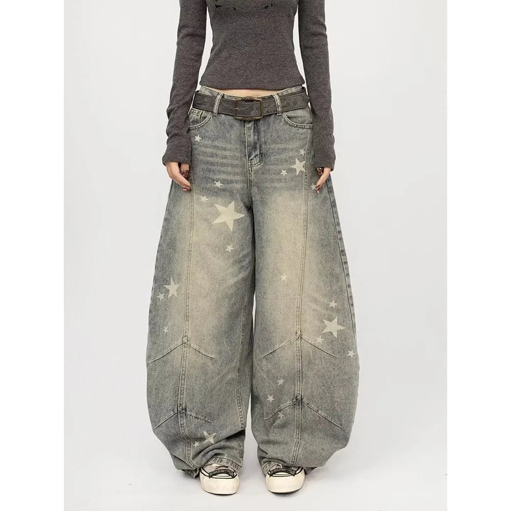 Men's blue loose fit jeans with vintage washed, distressed and grey splatter finish, mid-rise waist and long pant length.