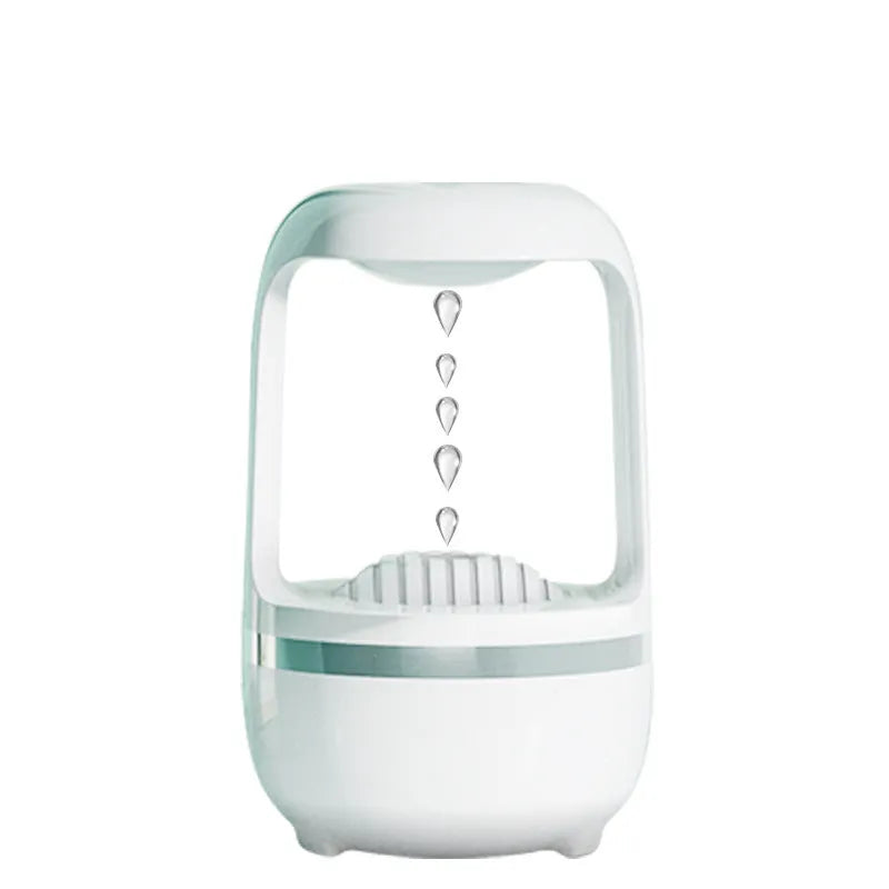 White anti-gravity water droplet humidifier with 500ml tank on a desk.