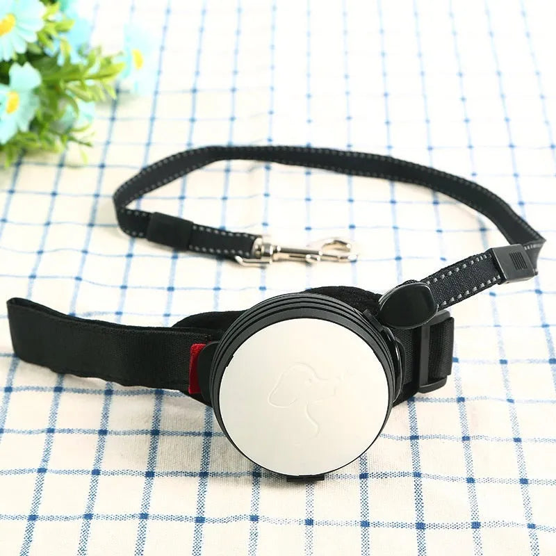 Automatic retractable dog leash showing pet holding hands design and 3 metre nylon cord