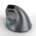 Gray Bluetooth vertical grip wireless mouse with self-charging, shown next to a laptop.