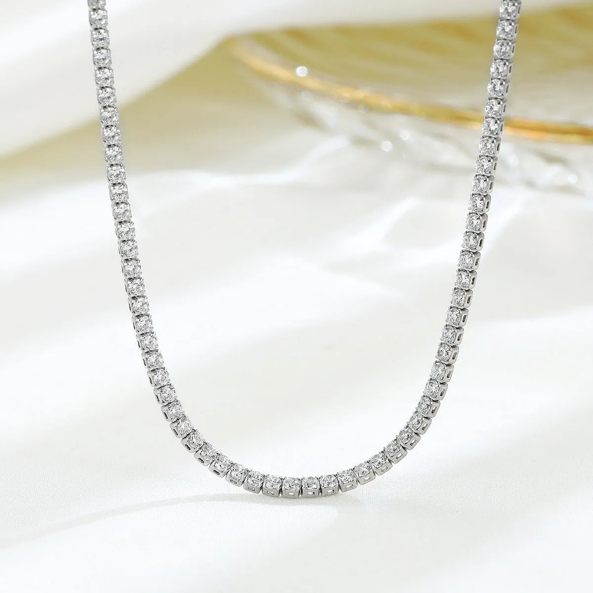 Women's sterling silver necklace with diamond-cut round pendant