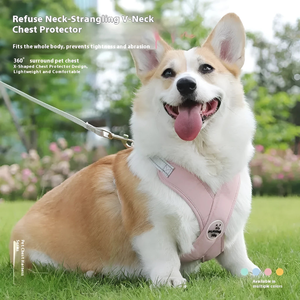 A pink polyester dog vest harness with an integrated hand holding rope laid flat.
