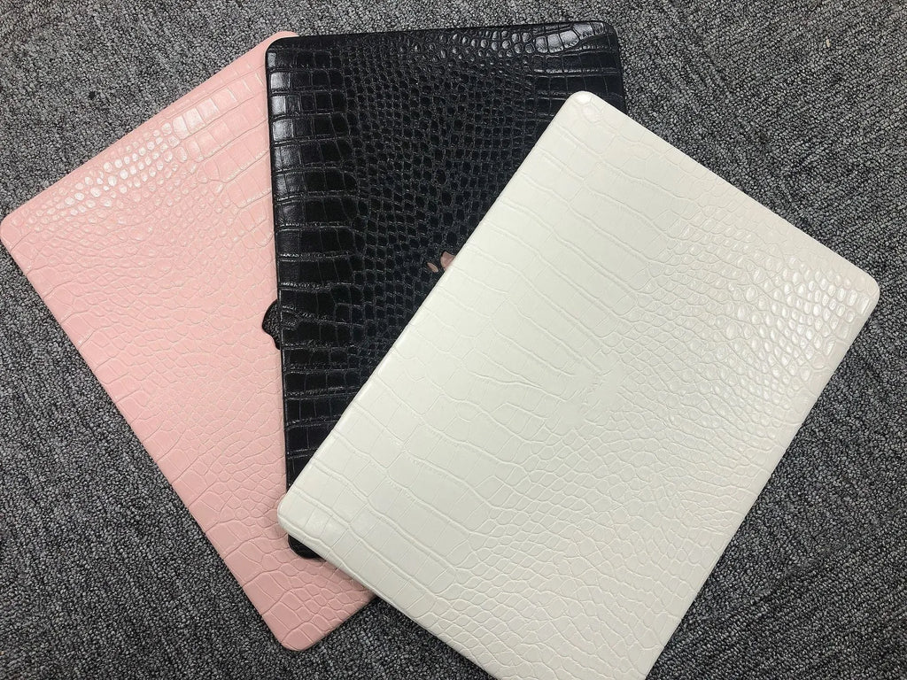 Crocodile pattern laptop protective case for MacBook Pro and Air in black, white or soft pink with hollow Apple logo.
