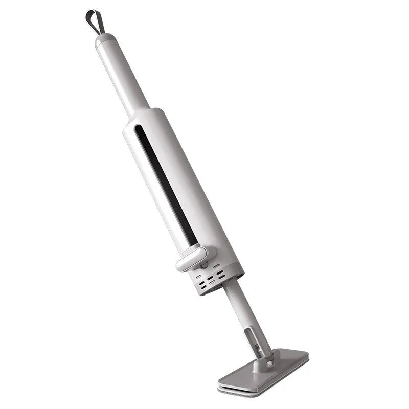 Rotatable self-squeeze mini mop with pink handle, crevice brush, and two microfiber pads on a tiled floor