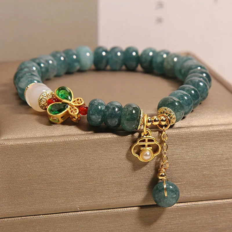 Blue water jade abacus beads crystal bracelet with butterfly clasp and white agate accents