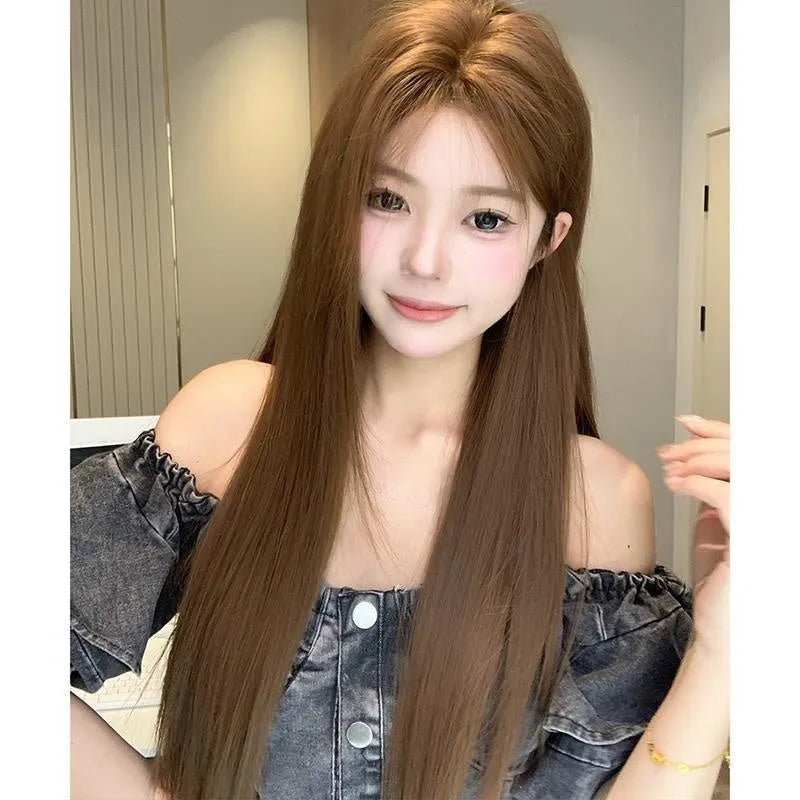 Women's warm brown wig with centre-parted bangs and long straight hair style showing forehead lace detail
