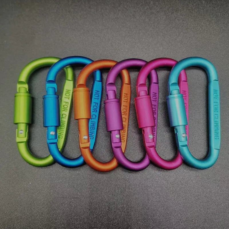 Aluminium D-shaped carabiner with lock shown in multiple colour options including black, silver, red, and blue.