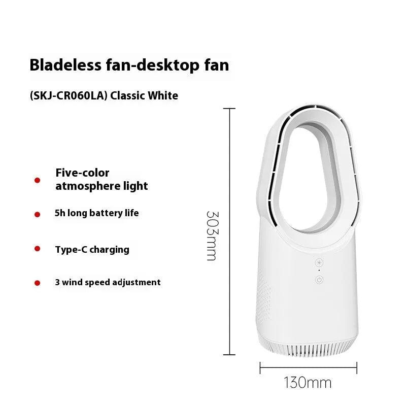 A white bladeless tower fan with a remote control on a wooden floor next to a desk.