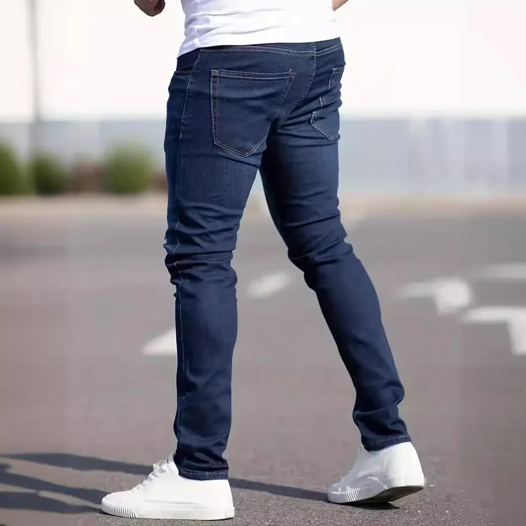 Dark blue men's slim fit skinny jeans with zipper fly on mid waist