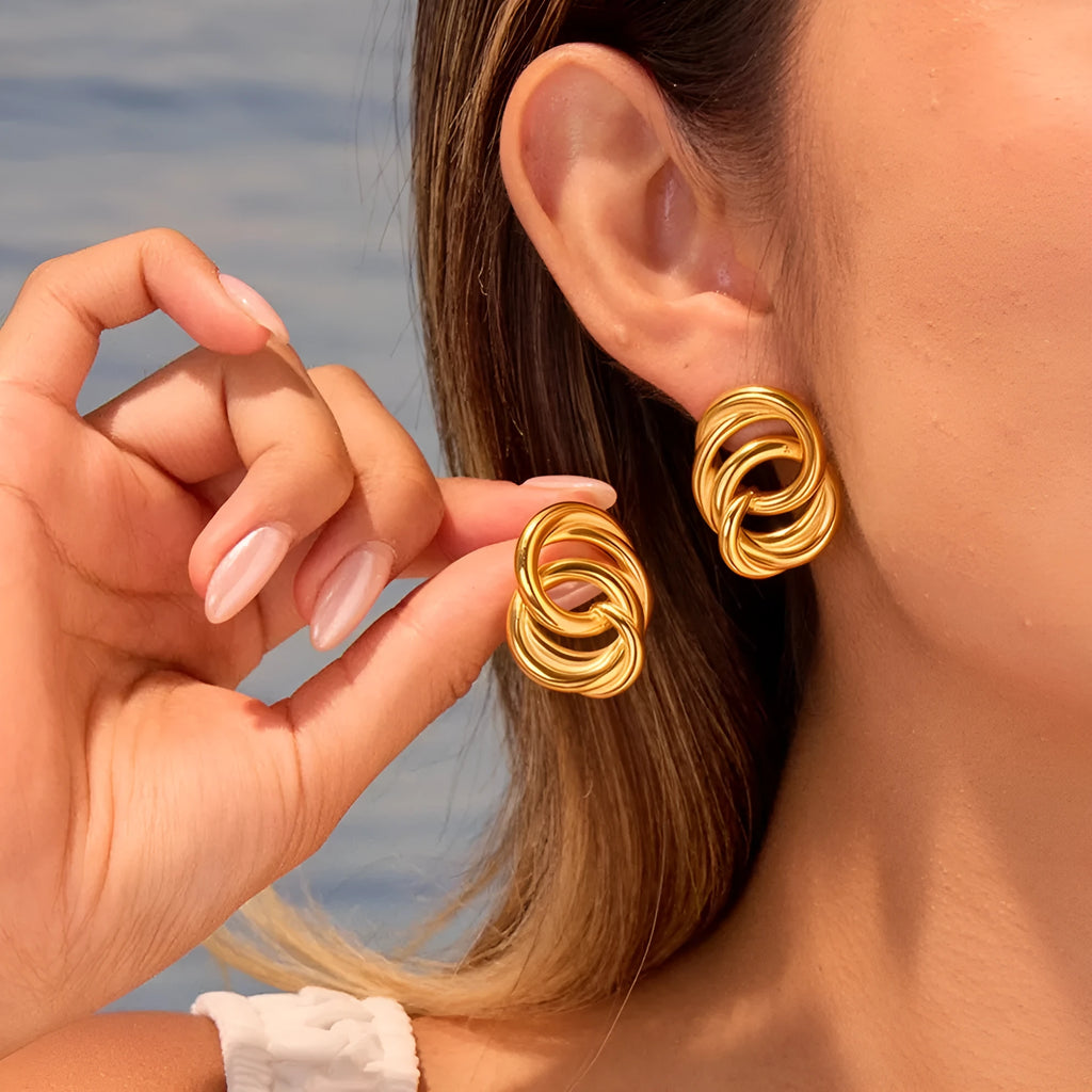 Gold geometric stud earrings with 18K electroplated finish on stainless steel
