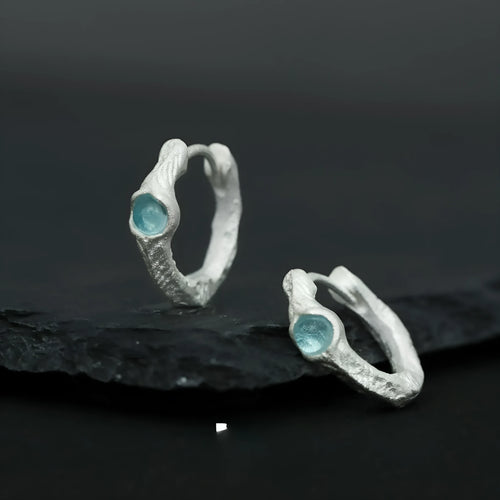 925 sterling silver geometric ear clip with burnt silver electroplated finish and round design elements.