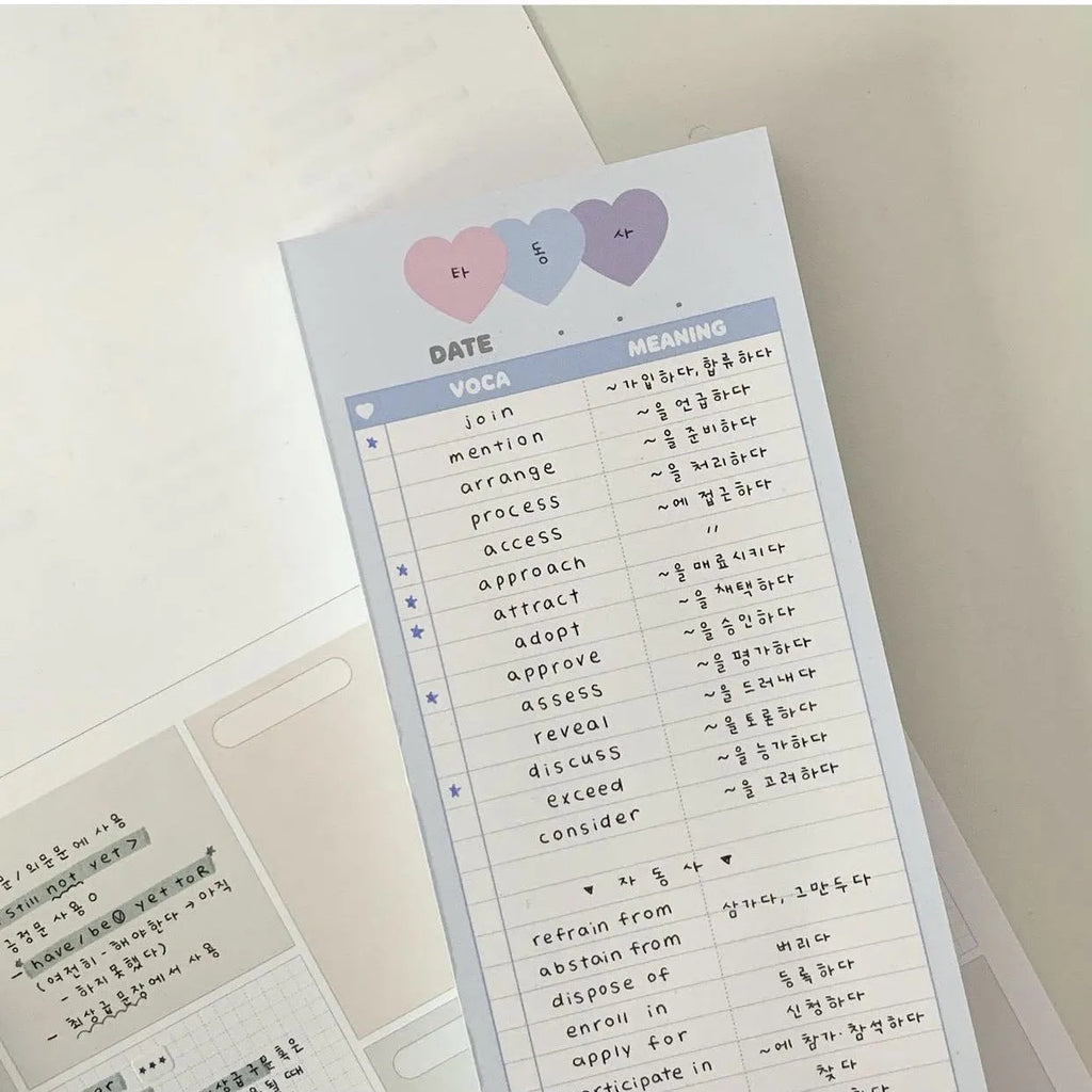 B5 half-size notepad with vertical English words printing in pink, purple, and blue cover colours.
