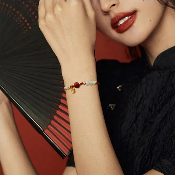 Adjustable women's bracelet with Hetian jade, cinnabar red rope, and 925 silver components
