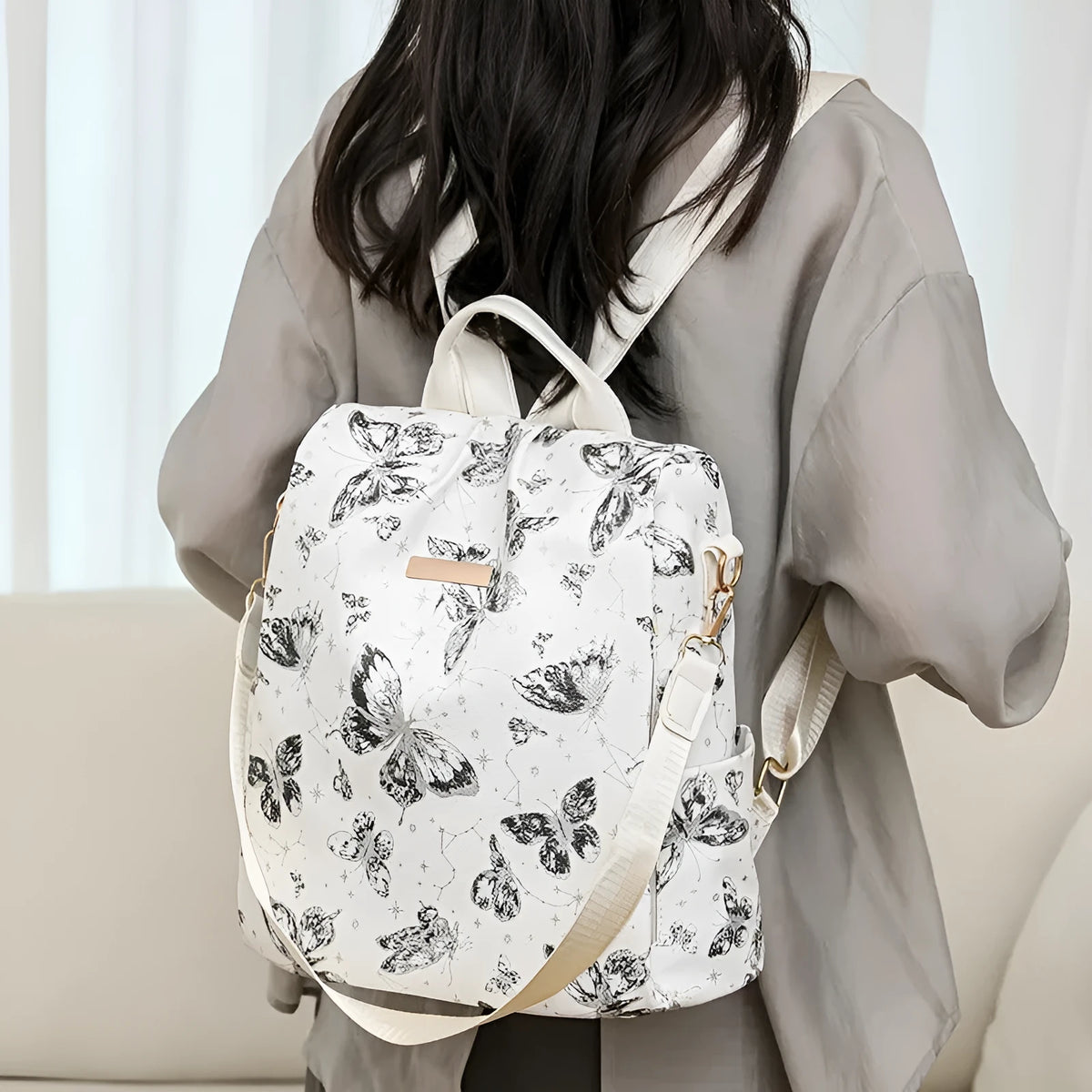 Butterfly printed large capacity backpack in multiple colours showing shoulder straps and fresh sweet style