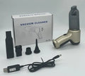 Handheld car pet vacuum cleaner in brushless gold or silver style with USB charging port and dust bucket.