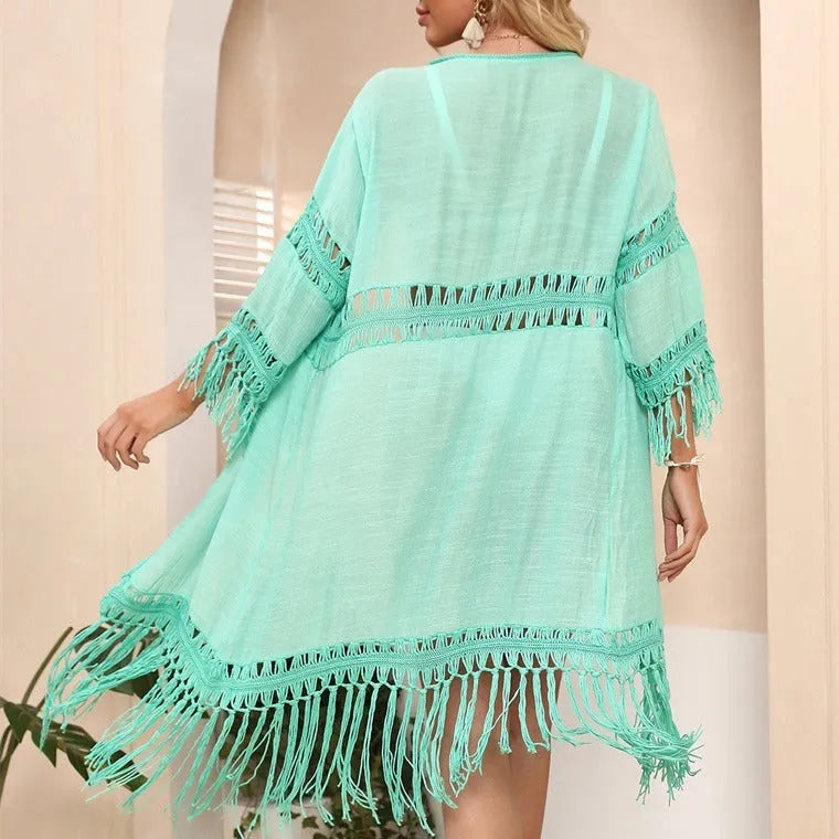 Women's loose-fit acrylic crochet cardigan with tassel stitching, shown in water green, for beach cover-up.