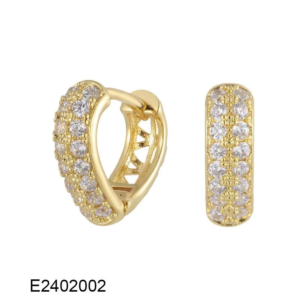 Gold plated heart shape ear clip earrings with crystal accents on white background