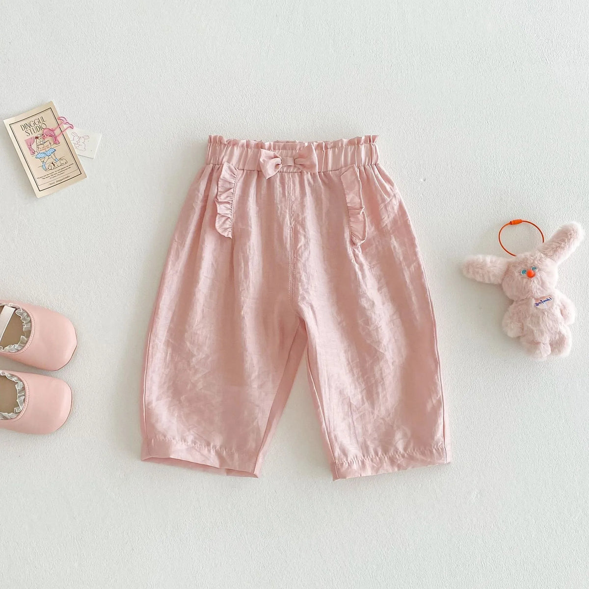 Girls' bow anti mosquito pants in cotton, solid colour, mid waist, available in rubber pink and cream beige, heights 73-120cm.