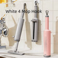 Rotatable self-squeeze mini mop with pink handle, crevice brush, and two microfiber pads on a tiled floor