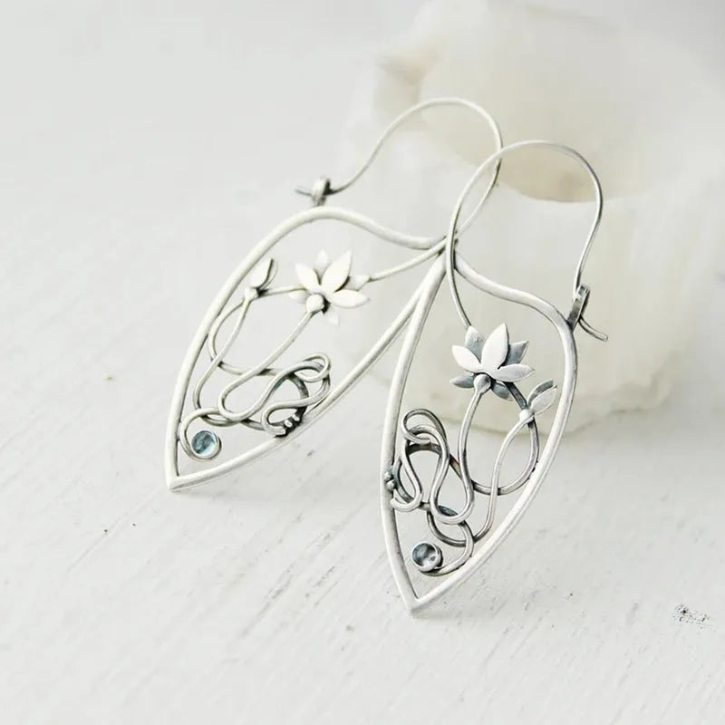Silver lotus vine and geometric shape drop earrings with rhinestone accents