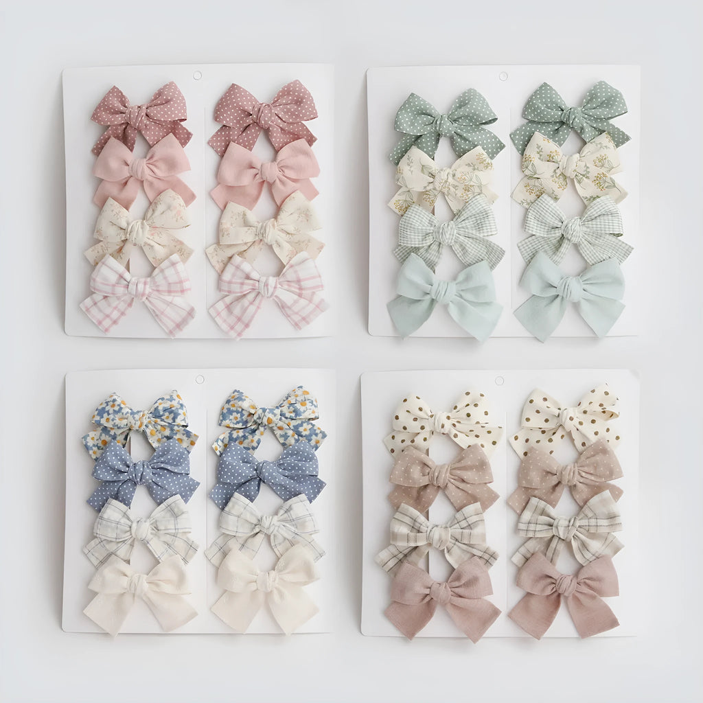 Children's cloth bow hairclip set showing dovetail shape in multiple colour options