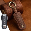 Retro style brown cowhide leather key cover with bag buckle for Porsche keys.