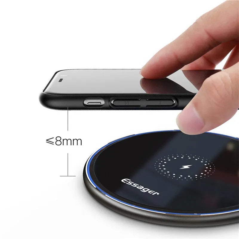 Black wireless charging pad with LED indicator light for phones and headphones