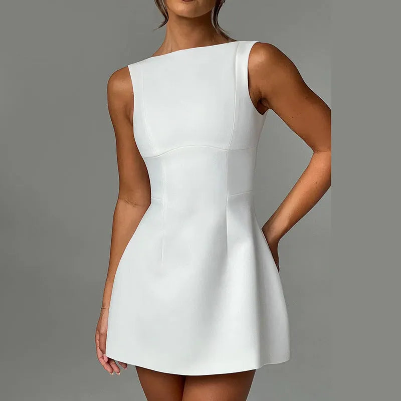 Slim-fitting black backless summer dress with sling-style straps and a high waist.