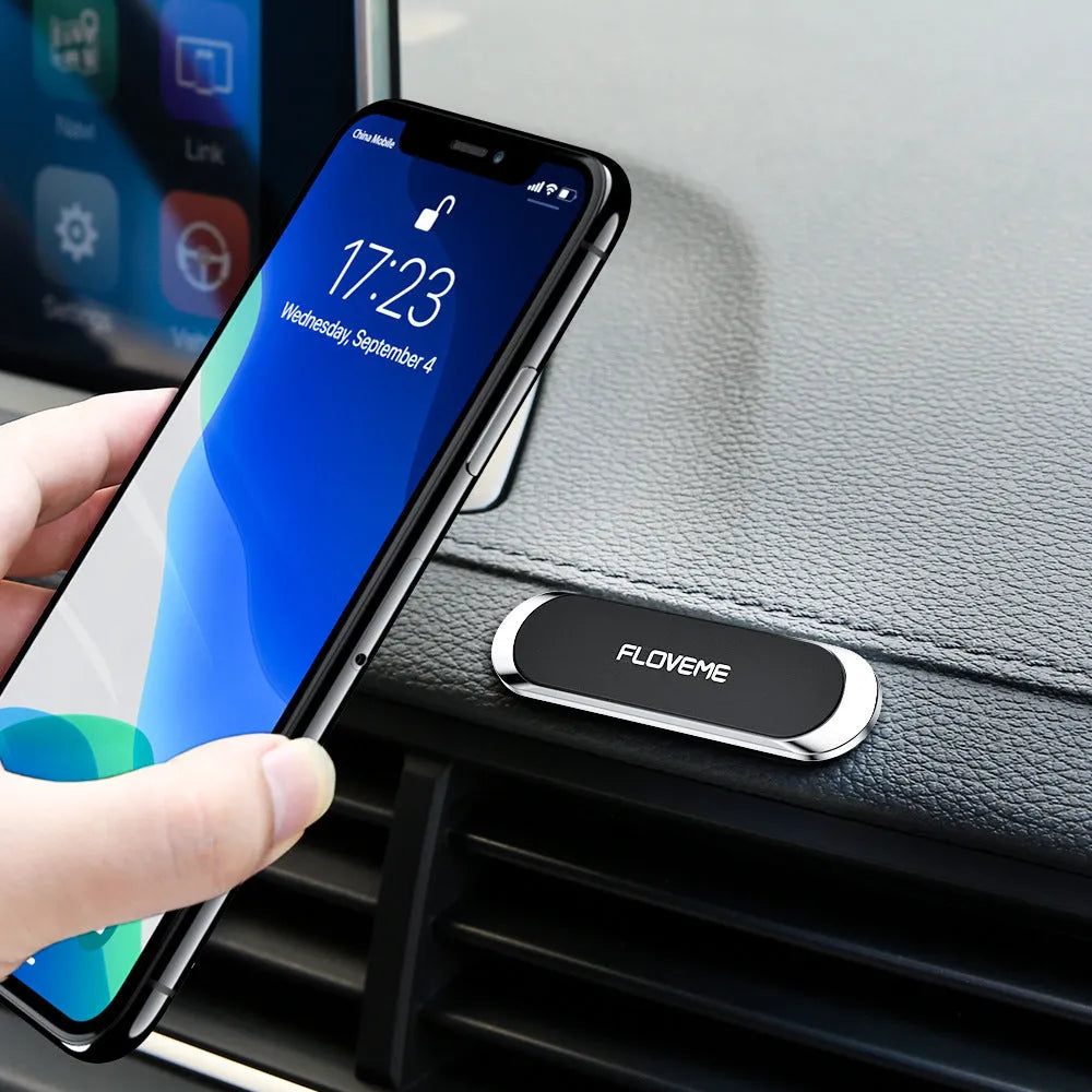 Black magnetic car phone holder with square silver iron sheet and white foam adhesive for dashboard mounting