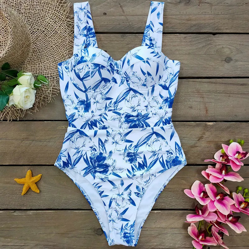 Printed white polyester one-piece swimsuit for ladies with flab hiding design, sleeveless cut