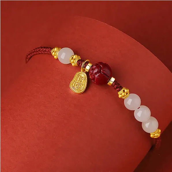 Adjustable women's bracelet with Hetian jade, cinnabar red rope, and 925 silver components