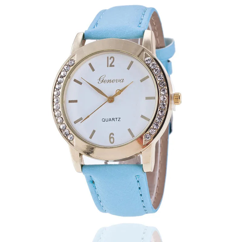 Geneva women's quartz watch with blue dial, round alloy case, and imitation leather strap on display